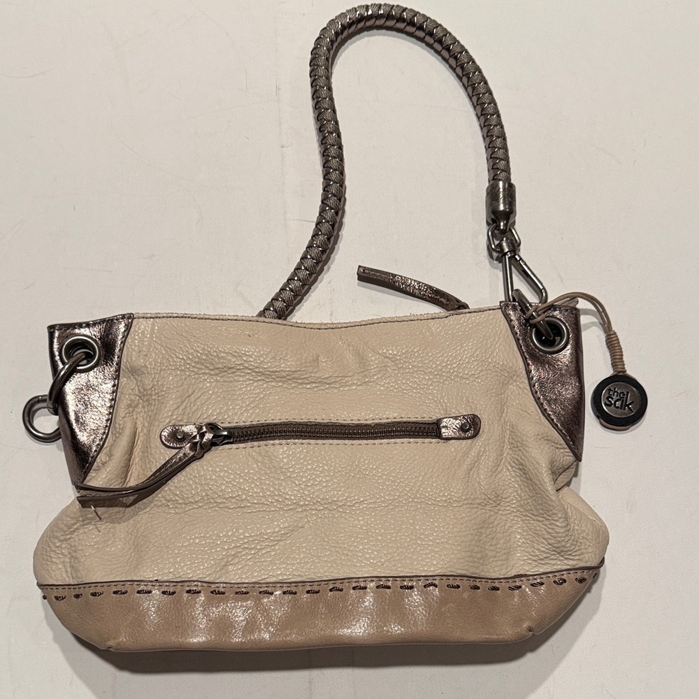 The Sak Tan and Silver Clutch